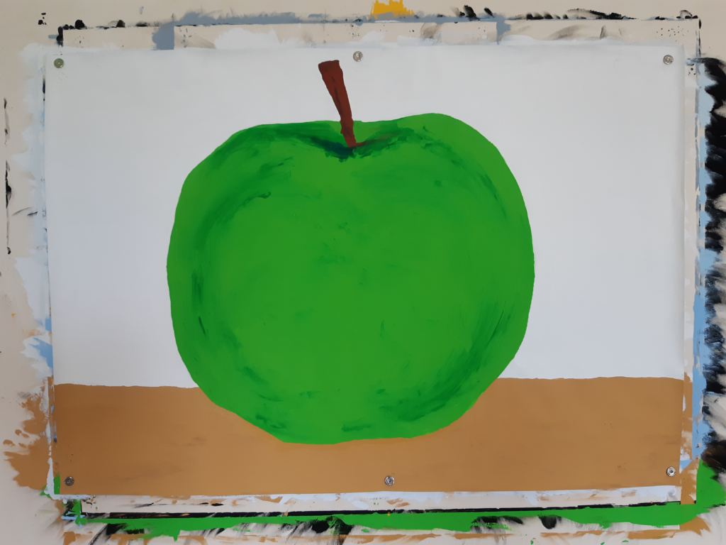 Bild von einem grünen gemalten Apfel.